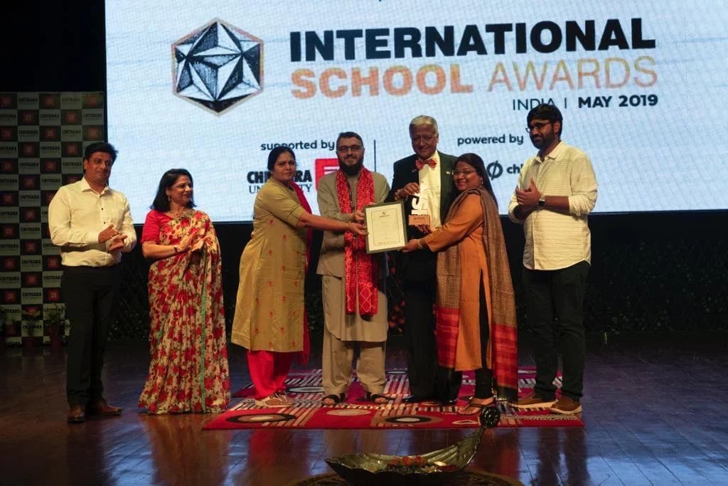 Pushpa Valli receiving recognition at the International School Awards in 2019.