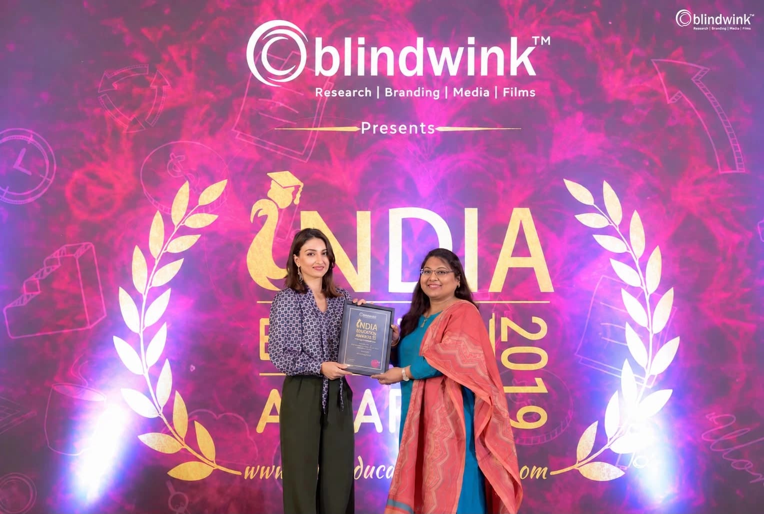 Pushpa Valli receiving her award at the India Education Awards in 2019.
