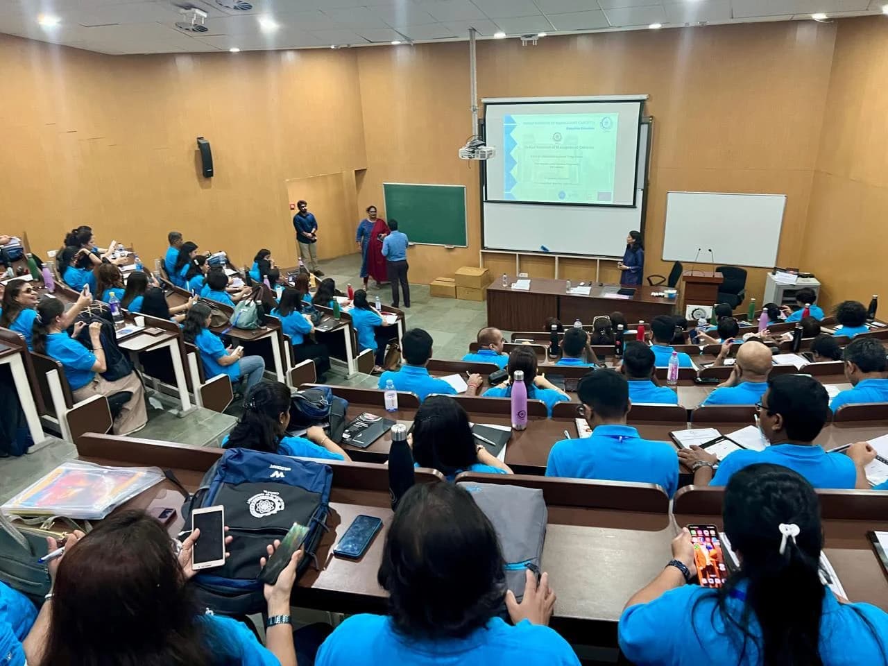Participants attending a professional learning session in a lecture theatre.